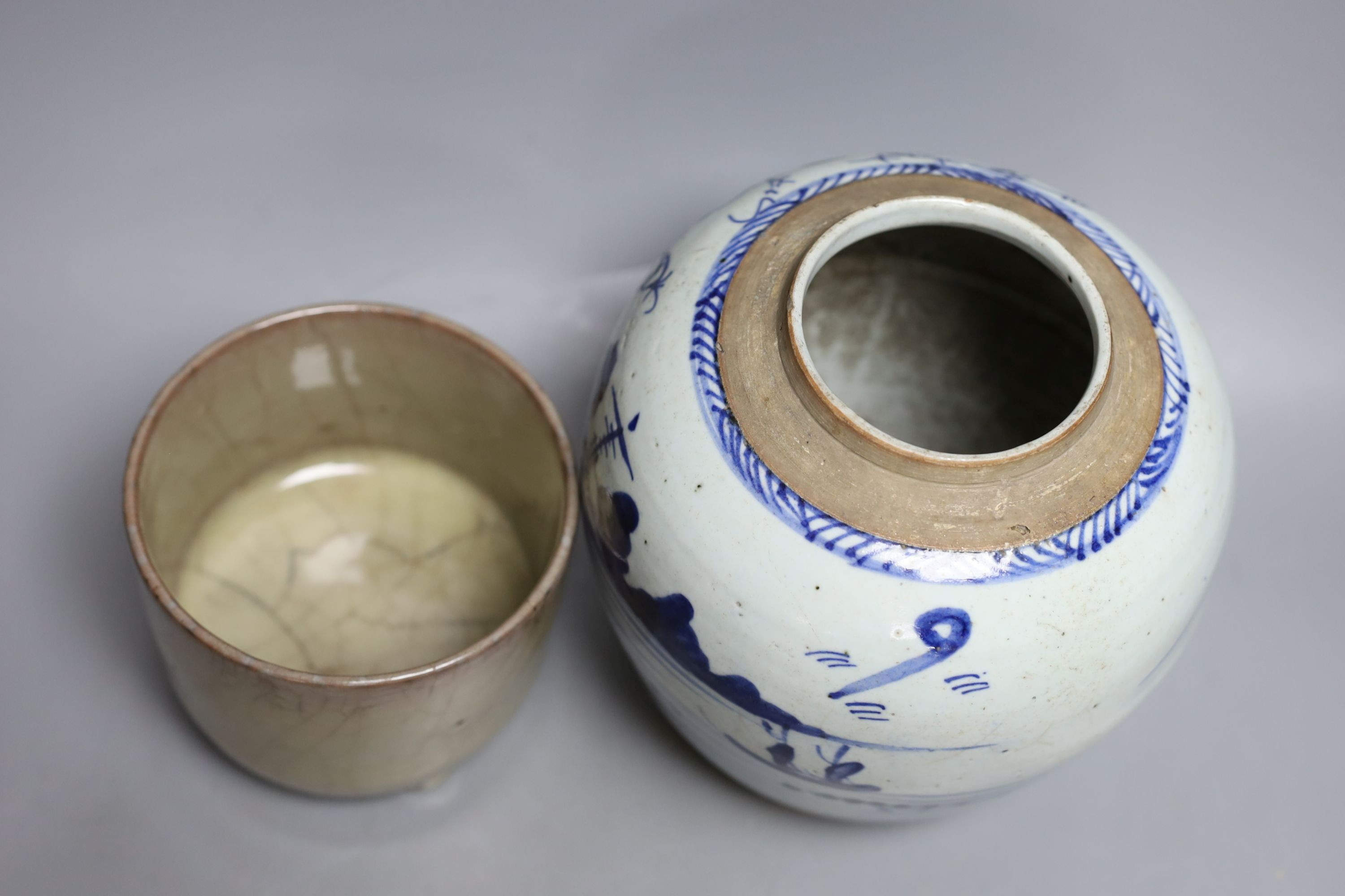 A 19th century Chinese blue and white jar depicting a village scene, together with a Chinese crackle glaze tripod censer - tallest 19cm